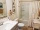 Traditional bathroom featuring a shower with a curtain, framed art, and a white vanity at 15250 Windward Ln, Lancaster, SC 29720