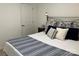 Cozy bedroom featuring a large bed with blue and white bedding and a bedside table at 15250 Windward Ln, Lancaster, SC 29720