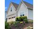 Charming home featuring a well-manicured lawn, beautiful landscaping and a two car garage at 15250 Windward Ln, Lancaster, SC 29720