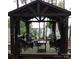 Relaxing gazebo with comfortable seating, outdoor lighting, and picturesque views of the lake at 15250 Windward Ln, Lancaster, SC 29720