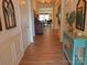 Welcoming hallway with hardwood floors, decorative accents, and a glimpse of the living area at 15250 Windward Ln, Lancaster, SC 29720