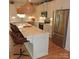 Modern kitchen with stainless steel appliances, a spacious island, and stylish lighting at 15250 Windward Ln, Lancaster, SC 29720
