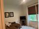 Comfortable living room with a flat-screen TV, natural light, and brown leather seating at 15250 Windward Ln, Lancaster, SC 29720
