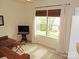 Cozy living room featuring a flat-screen TV, natural light and comfortable seating at 15250 Windward Ln, Lancaster, SC 29720