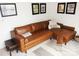 Inviting living room featuring a brown leather sofa, a striped rug, and framed art at 15250 Windward Ln, Lancaster, SC 29720