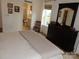 Bedroom featuring an ensuite bath, dresser, and natural light at 15250 Windward Ln, Lancaster, SC 29720