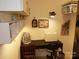 This home office space offers great lighting, built-in storage, and room for a sewing machine at 15250 Windward Ln, Lancaster, SC 29720