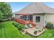 Beautiful backyard with a patio, wooden deck, lush green lawn, and seating for outdoor relaxation at 1575 Williamsburg Dr, Rock Hill, SC 29732