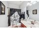 Charming bathroom with a Paris themed shower curtain, a decorative mirror, and ample lighting at 1575 Williamsburg Dr, Rock Hill, SC 29732