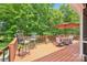 Spacious deck with outdoor seating and an umbrella, perfect for enjoying sunny days and green views at 1575 Williamsburg Dr, Rock Hill, SC 29732