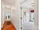 Hallway with access to carpeted bedroom and hardwood flooring at 1575 Williamsburg Dr, Rock Hill, SC 29732