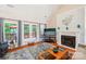Cozy living room with fireplace, French doors leading to the outdoor deck at 1575 Williamsburg Dr, Rock Hill, SC 29732