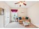 Living room with neutral paint, carpet flooring, a sofa with pillows, and a window with sheer curtains at 1575 Williamsburg Dr, Rock Hill, SC 29732