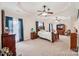 Oversized main bedroom boasts a tray ceiling, sitting area, ceiling fan and large windows at 1575 Williamsburg Dr, Rock Hill, SC 29732