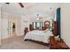 Spacious main bedroom featuring a tray ceiling, ceiling fan, and carpet flooring at 1575 Williamsburg Dr, Rock Hill, SC 29732