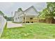 Spacious backyard with a wooden porch, perfect for outdoor entertaining at 1721 S New Hope Rd, Gastonia, NC 28054