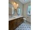 Updated bathroom featuring dual sinks, decorative tile, and contemporary fixtures at 1721 S New Hope Rd, Gastonia, NC 28054
