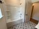Clean bathroom showcases a built-in bathtub with white surround at 1721 S New Hope Rd, Gastonia, NC 28054