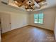 Bedroom featuring hardwood floors, coffered ceiling, and a window that brings in natural light at 1721 S New Hope Rd, Gastonia, NC 28054