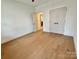 Bedroom with hardwood flooring and closet; featuring ample light and modern design at 1721 S New Hope Rd, Gastonia, NC 28054