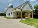 Spacious home featuring a large covered back porch and extended driveway at 1721 S New Hope Rd, Gastonia, NC 28054