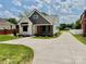 Well-manicured lawn with stone accents at 1721 S New Hope Rd, Gastonia, NC 28054