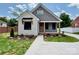 Charming home with stone and siding exterior, landscaped front yard, and inviting covered porch at 1721 S New Hope Rd, Gastonia, NC 28054