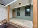 Inviting front porch with stone accents, cedar post, and neutral tones at 1721 S New Hope Rd, Gastonia, NC 28054
