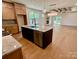 Open kitchen and living area featuring granite counters, stainless appliances, wood floors, and fireplace at 1721 S New Hope Rd, Gastonia, NC 28054