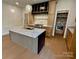 Stylish kitchen with custom island, granite countertops, hardwood floors and modern stainless appliances at 1721 S New Hope Rd, Gastonia, NC 28054