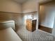 Laundry room with built-in bench, storage, stylish tile and sink at 1721 S New Hope Rd, Gastonia, NC 28054