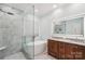Modern bathroom with glass shower, soaking tub, and double vanity at 207 Spaniel Se Dr, Concord, NC 28025
