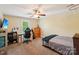 A comfortable bedroom with ample space, neutral walls and a ceiling fan at 207 Spaniel Se Dr, Concord, NC 28025