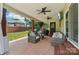 Spacious covered patio with outdoor seating, ceiling fans, and a view of the backyard at 207 Spaniel Se Dr, Concord, NC 28025