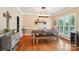 Traditional dining room with wooden table, bench seating, and natural light at 207 Spaniel Se Dr, Concord, NC 28025