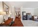 Inviting foyer with hardwood floors, decorative mirror, and a glimpse into the living area at 207 Spaniel Se Dr, Concord, NC 28025