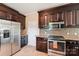 Updated kitchen featuring stainless steel appliances, granite countertops, and ample cabinet space at 207 Spaniel Se Dr, Concord, NC 28025