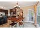 Kitchen with wooden table and seating with stainless steel appliances and dark cabinetry at 207 Spaniel Se Dr, Concord, NC 28025