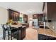 Well-equipped kitchen with stainless steel appliances, island seating and tiled backsplash at 207 Spaniel Se Dr, Concord, NC 28025