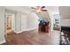 Bright office area with desk, monitors, chair, hardwood floors and ample natural light at 207 Spaniel Se Dr, Concord, NC 28025
