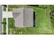 Aerial view showcasing the home's roof, landscaping, and proximity to the street at 2527 Linhay Dr, Charlotte, NC 28216