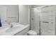 Clean bathroom with a glass-enclosed shower and modern vanity with sink at 2527 Linhay Dr, Charlotte, NC 28216
