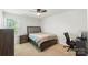 Bedroom with neutral carpet, ceiling fan, and desk space at 2527 Linhay Dr, Charlotte, NC 28216