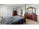 Bedroom with four poster bed, dark wood furnishings, and mounted TV at 2527 Linhay Dr, Charlotte, NC 28216