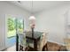 Dining area with sliding glass doors that open to the exterior, modern light fixture at 2527 Linhay Dr, Charlotte, NC 28216