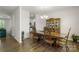 Elegant dining room featuring a classic wooden dining set, chandelier lighting and wood floors at 2527 Linhay Dr, Charlotte, NC 28216