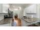 Bright, open kitchen featuring granite counters, white cabinets, and stainless steel appliances at 2527 Linhay Dr, Charlotte, NC 28216
