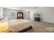 Large main bedroom with two windows and a dresser at 2527 Linhay Dr, Charlotte, NC 28216