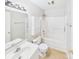 Bathroom featuring a shower-tub combo, a vanity with a sink, and neutral decor, offering a functional space at 2541 26Th Ne Ave, Hickory, NC 28601