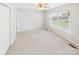 Bright bedroom featuring neutral carpet, ceiling fan, and a window with natural light at 2541 26Th Ne Ave, Hickory, NC 28601